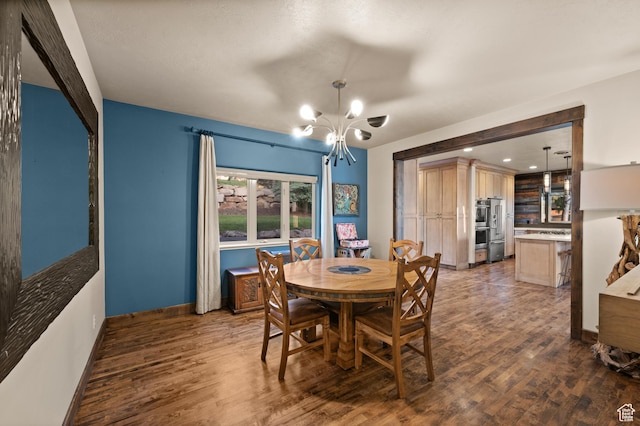 8932 Flint Way, Park City, UT 84098 - dining area featuring a chandelier, wood finished floors, and baseboards