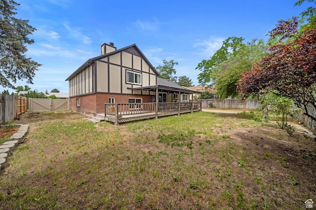 1591 E Waters Ln, Sandy, UT 84093 - rear view of property with brick siding, a chimney, a deck, and a gate