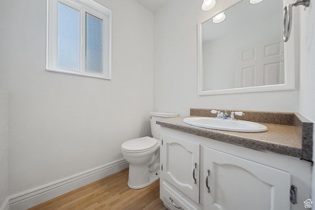 1591 E Waters Ln, Sandy, UT 84093 - bathroom with vanity, toilet, wood finished floors, and baseboards