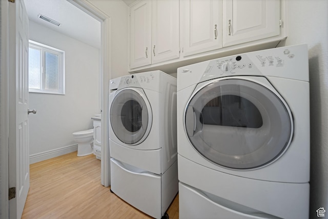 1591 E Waters Ln, Sandy, UT 84093 - laundry area with separate washer and dryer, light wood finished floors, and baseboards