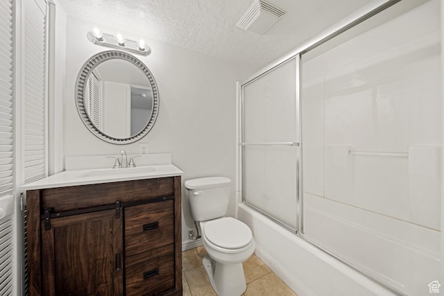 1591 E Waters Ln, Sandy, UT 84093 - bathroom featuring vanity, toilet, tile patterned floors, shower / bath combination with glass door, and a textured ceiling