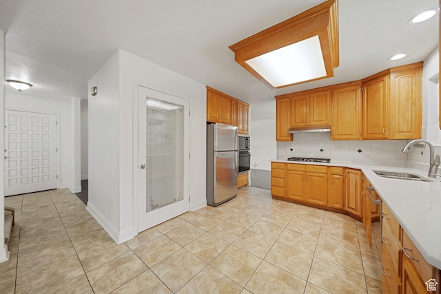 1591 E Waters Ln, Sandy, UT 84093 - kitchen featuring stainless steel appliances, a sink, under cabinet range hood, light countertops, and light tile patterned flooring
