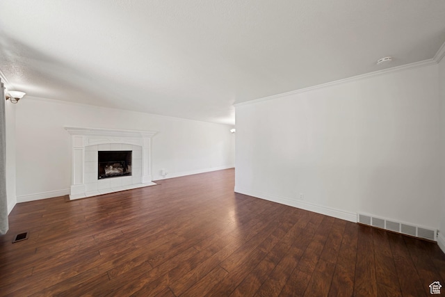 1591 E Waters Ln, Sandy, UT 84093 - unfurnished living room featuring wood-type flooring, a tiled fireplace, ornamental molding, and baseboards