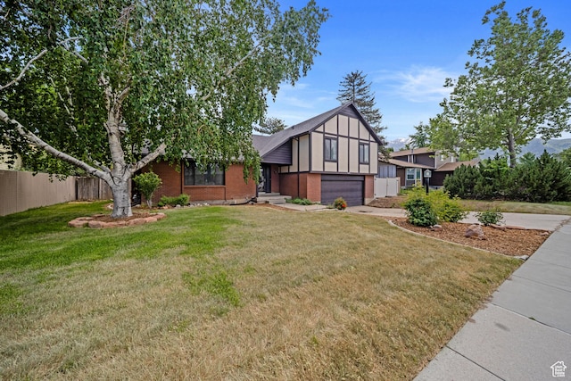 1591 E Waters Ln, Sandy, UT 84093 - tudor home featuring a garage, brick siding, and driveway