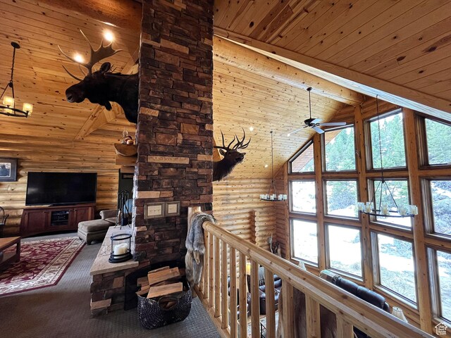 2665 Government Dam Rd, Soda Springs, ID 83276 - living area featuring rustic walls, high vaulted ceiling, wood ceiling with exposed beams, carpet flooring, and a ceiling fan