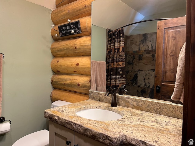 2665 Government Dam Rd, Soda Springs, ID 83276 - bathroom with toilet, vanity, curtained shower, and rustic walls