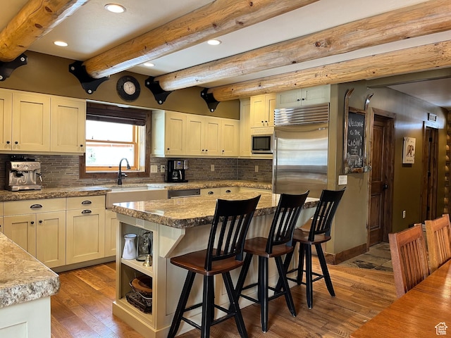 2665 Government Dam Rd, Soda Springs, ID 83276 - kitchen with appliances with stainless steel finishes, a sink, wood finished floors, a kitchen breakfast bar, and recessed lighting