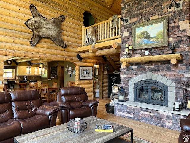 2665 Government Dam Rd, Soda Springs, ID 83276 - living area featuring rustic walls, wood finished floors, a fireplace, and a high ceiling