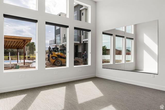 2353 W Miles Ln Unit D14, West Haven, UT 84401 - carpeted spare room with healthy amount of natural light and baseboards