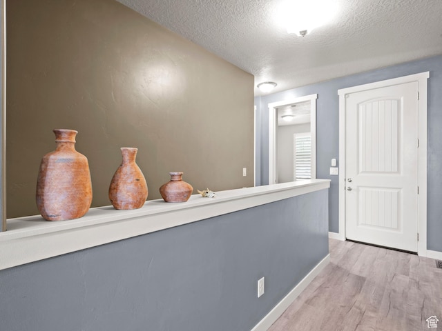 9558 S Lea Heather Way, West Jordan, UT 84081 - bar with light wood-style flooring, a textured ceiling, and baseboards