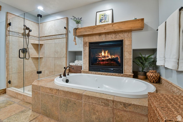 7841 Engen Loop, Park City, UT 84098 - full bathroom with stone tile flooring, a bath, a shower stall, and a tile fireplace