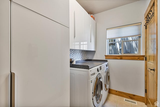 7841 Engen Loop, Park City, UT 84098 - laundry area with washing machine and clothes dryer, cabinet space, light tile patterned floors, and baseboards