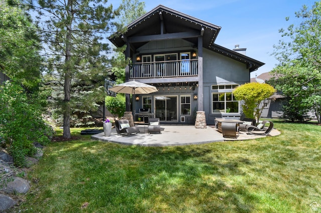 7841 Engen Loop, Park City, UT 84098 - back of house with a balcony, a chimney, a patio, a yard, and an outdoor hangout area