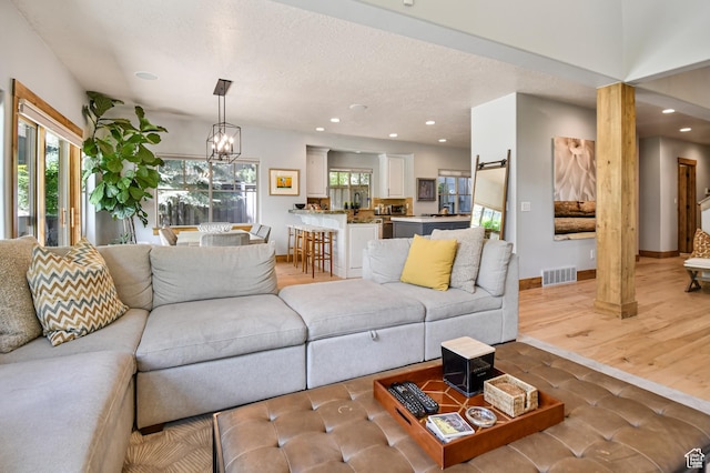 7841 Engen Loop, Park City, UT 84098 - living area with recessed lighting, a chandelier, a textured ceiling, and baseboards