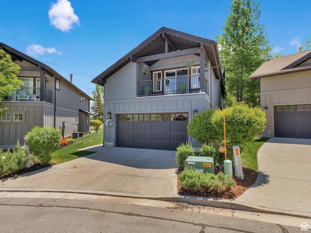 7841 Engen Loop, Park City, UT 84098 - view of front facade with a balcony, concrete driveway, and a garage