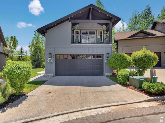 7841 Engen Loop, Park City, UT 84098 - view of front of property with an attached garage, board and batten siding, concrete driveway, and a balcony
