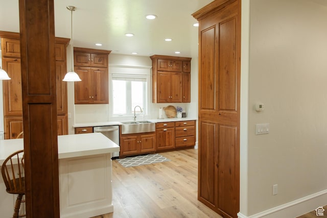 1380 N 300 W, Blanding, UT 84511 - kitchen with dishwasher, a sink, light wood-style flooring, brown cabinetry, and light countertops