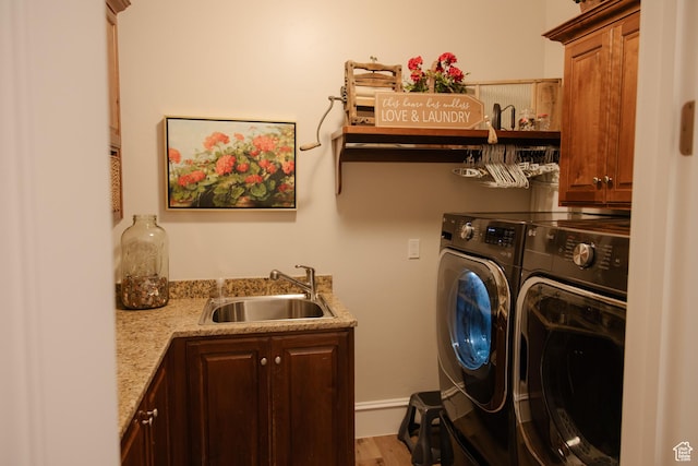 1380 N 300 W, Blanding, UT 84511 - laundry room featuring washer and clothes dryer, cabinet space, bar with sink, and wood finished floors