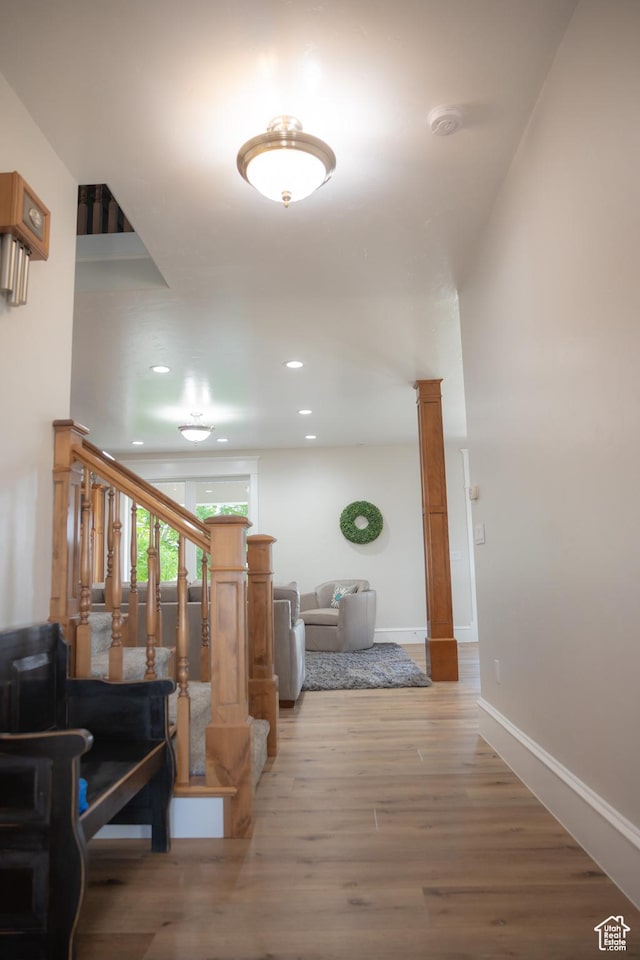 1380 N 300 W, Blanding, UT 84511 - hall with decorative columns, light wood-style floors, recessed lighting, baseboards, and stairs