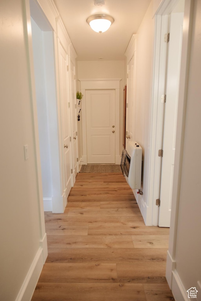 1380 N 300 W, Blanding, UT 84511 - corridor with heating unit, light wood-type flooring, and baseboards