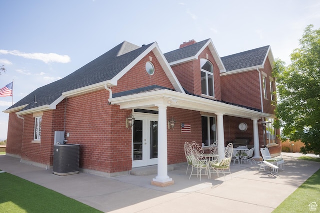 1380 N 300 W, Blanding, UT 84511 - rear view of property featuring french doors, brick siding, a shingled roof, and a patio