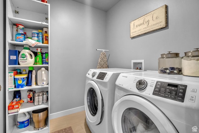 4185 W 800 S, Syracuse, UT 84075 - laundry area featuring washer and dryer, wood finished floors, and baseboards