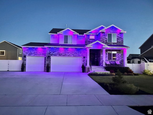 4185 W 800 S, Syracuse, UT 84075 - view of front of home featuring stone siding, an attached garage, and concrete driveway