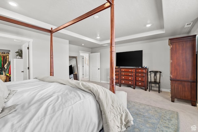 4185 W 800 S, Syracuse, UT 84075 - bedroom featuring light carpet, a spacious closet, a tray ceiling, baseboards, and recessed lighting