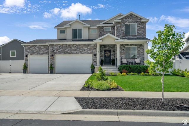 4185 W 800 S, Syracuse, UT 84075 - view of front of house featuring stone siding, driveway, stucco siding, covered porch, and an attached garage