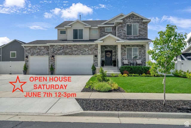 4185 W 800 S, Syracuse, UT 84075 - view of front of house featuring stone siding, stucco siding, driveway, covered porch, and a garage