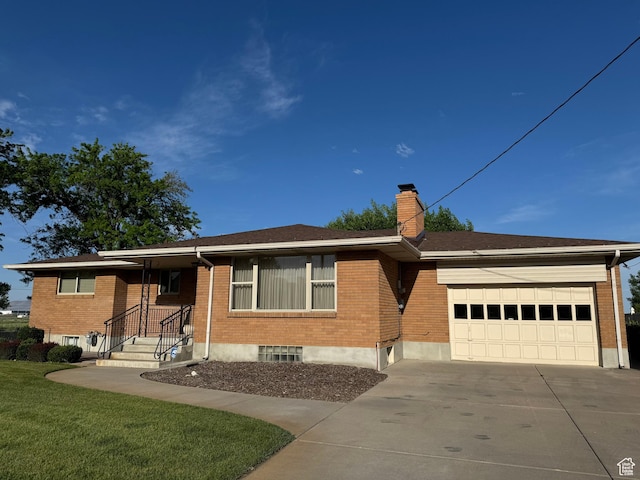 2650 S 2000 W, Syracuse, UT 84075 - ranch-style house featuring brick siding, concrete driveway, an attached garage, a chimney, and a front yard