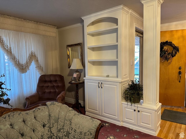 2650 S 2000 W, Syracuse, UT 84075 - living area featuring wood finished floors, built in shelves, ornamental molding, baseboards, and decorative columns