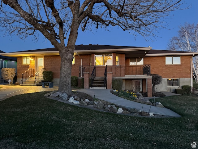 2650 S 2000 W, Syracuse, UT 84075 - ranch-style home with brick siding, a front yard, and stairs