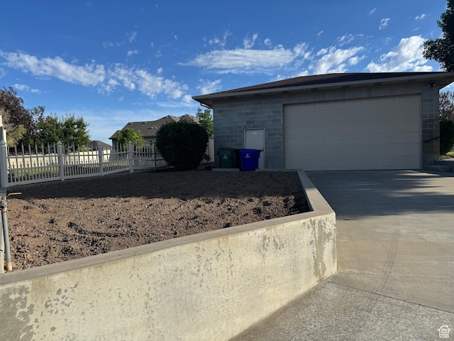 2650 S 2000 W, Syracuse, UT 84075 - view of property exterior with a garage and concrete driveway