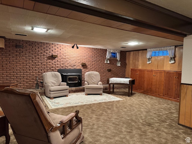 2650 S 2000 W, Syracuse, UT 84075 - carpeted living room with brick wall, wooden walls, and a wood stove