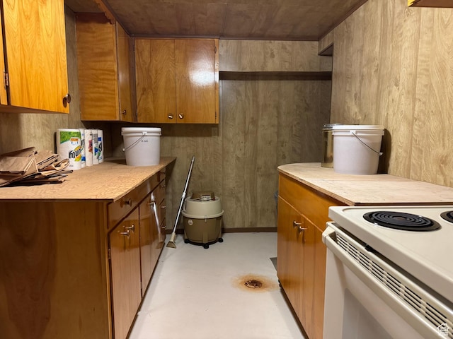 2650 S 2000 W, Syracuse, UT 84075 - kitchen featuring brown cabinetry, light countertops, finished concrete flooring, and electric range