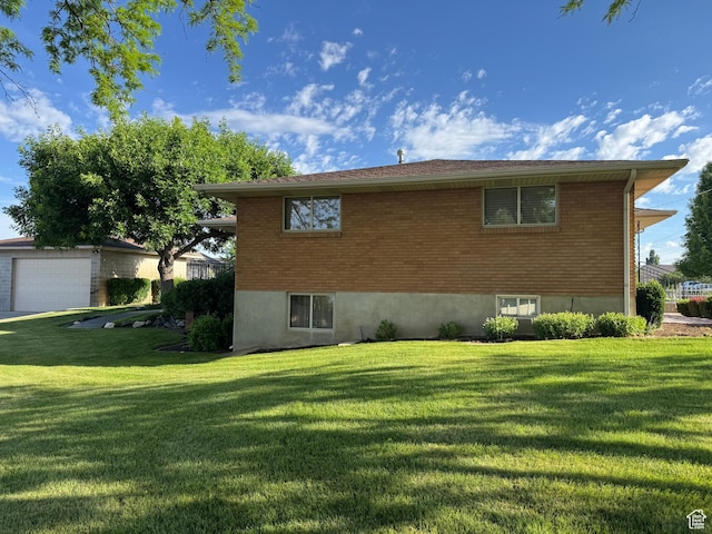 2650 S 2000 W, Syracuse, UT 84075 - view of property exterior with a lawn, brick siding, and a garage