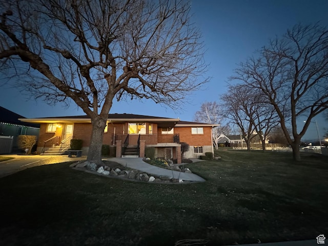 2650 S 2000 W, Syracuse, UT 84075 - rear view of house featuring brick siding, a yard, and stairway