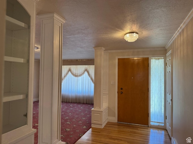 2650 S 2000 W, Syracuse, UT 84075 - foyer entrance featuring wood finished floors, a textured ceiling, and plenty of natural light