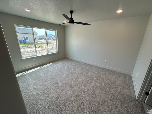 570 N 600 W, Smithfield, UT 84335 - empty room featuring carpet floors, a ceiling fan, baseboards, a textured ceiling, and recessed lighting