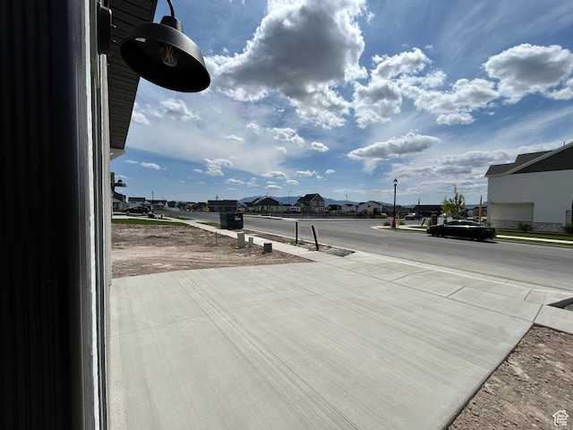 570 N 600 W, Smithfield, UT 84335 - view of concrete road featuring a residential view, sidewalks, and street lights
