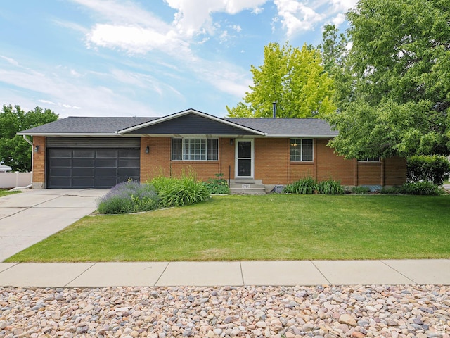 2755 W Mocha Cir, Taylorsville, UT 84129 - single story home featuring an attached garage, concrete driveway, brick siding, and a front yard
