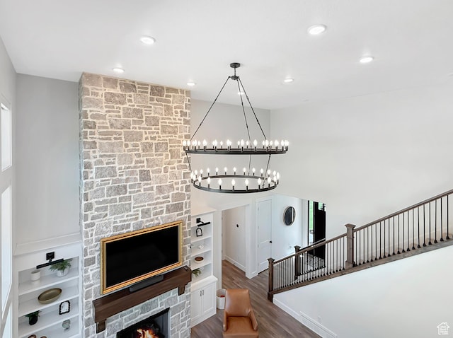 2558 N 1150 E, North Ogden, UT 84414 - living area featuring wood finished floors, a chandelier, recessed lighting, and built in shelves