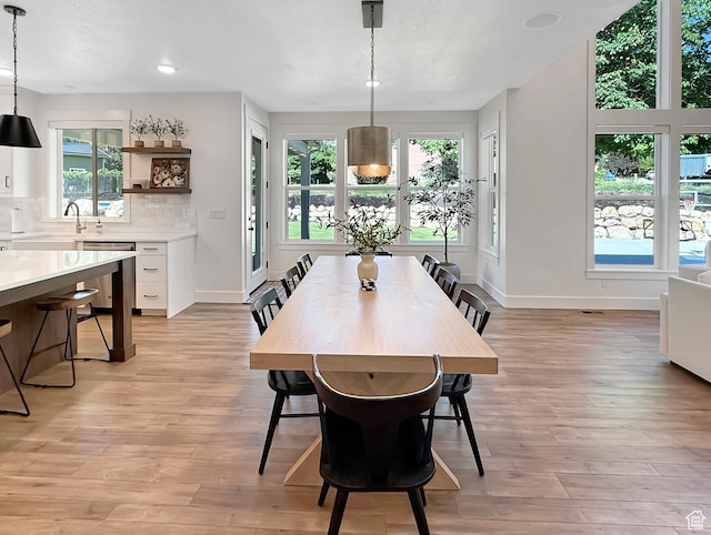 2558 N 1150 E, North Ogden, UT 84414 - dining room with light wood-type flooring, baseboards, and recessed lighting