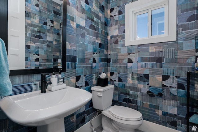 11579 N Groves Edge Dr, Hideout, UT 84036 - bathroom featuring tile walls, a sink, toilet, and backsplash