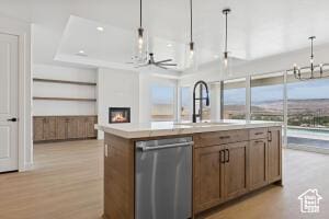 579 S 1800 W, Hurricane, UT 84737 - kitchen featuring dishwasher, a chandelier, light countertops, decorative light fixtures, and an island with sink