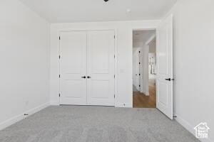579 S 1800 W, Hurricane, UT 84737 - unfurnished bedroom featuring carpet, baseboards, and a closet