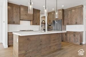 579 S 1800 W, Hurricane, UT 84737 - kitchen with freestanding refrigerator, light countertops, hanging light fixtures, and recessed lighting