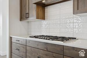 579 S 1800 W, Hurricane, UT 84737 - kitchen featuring stainless steel gas cooktop, tasteful backsplash, extractor fan, and light countertops