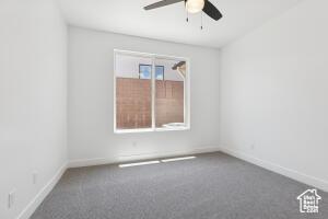 579 S 1800 W, Hurricane, UT 84737 - carpeted empty room featuring ceiling fan and baseboards